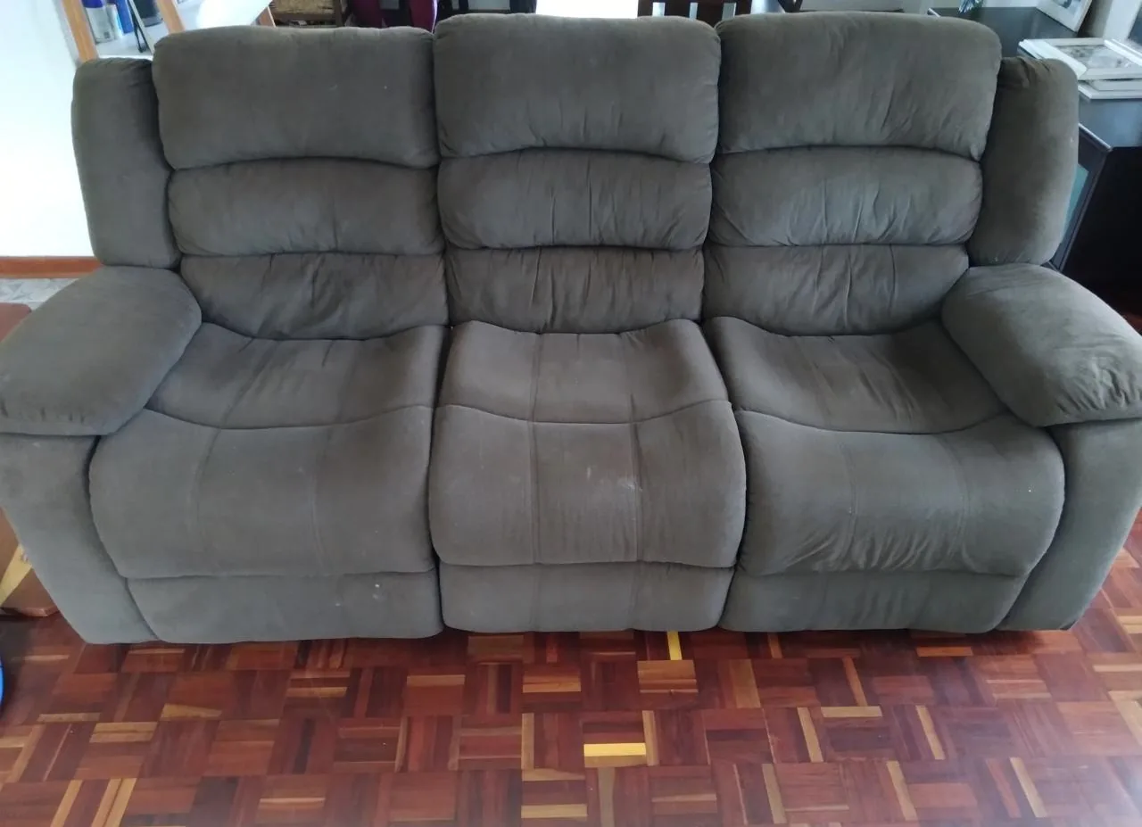Grey upholstered couch before cleaning